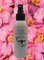 Goodwood Produce's MGO Honey Body mist which is on a pink flower background