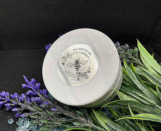 A 50g jar of MGO Honey & Camel milk pain cream with CBD oil in it.