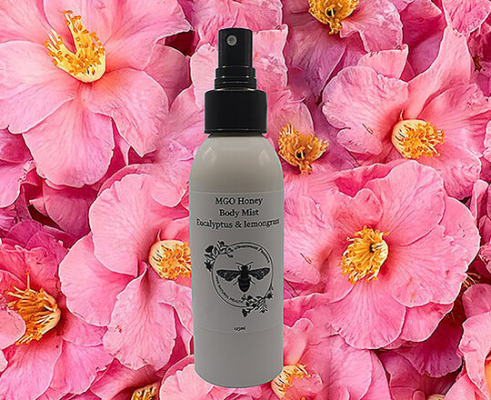 Goodwood Produce's MGO Honey Body mist which is on a pink flower background