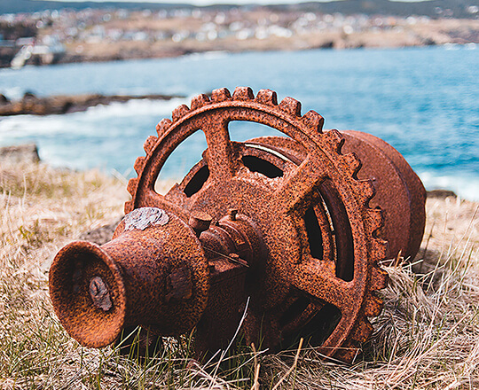Rusted metal gear Photo by Erik Mclean on Unsplash