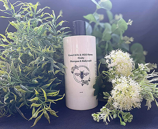 MGO honey & Camel Milk Shampoo bottle nicely on display