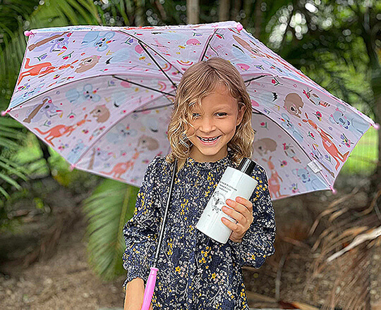 girl holding Goodwood Produce's MGO Honey & Camel milk Conditioner