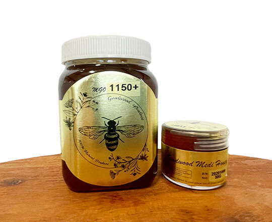 Medical grade honey in bottles and tubs on wooden tubs