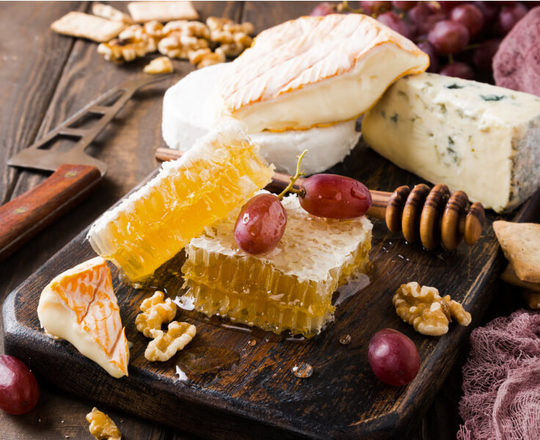 Honey and honeycomb on cheese platter